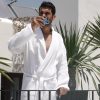 Man enjoying a coffee on the rooftop terrace of The Giri Luxury Residence, featured in a PuraVideos lifestyle film highlighting Ibiza’s luxury and relaxed atmosphere