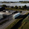 Drone shot of a Hermus International truck transporting goods across Europe, featured in a PuraVideos brand film showcasing reliable logistics services